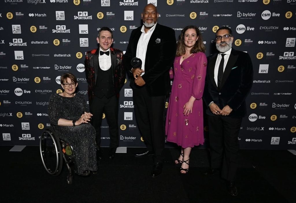 John Amaechi receiving the Sport Industry Group Integrity and Impact Award